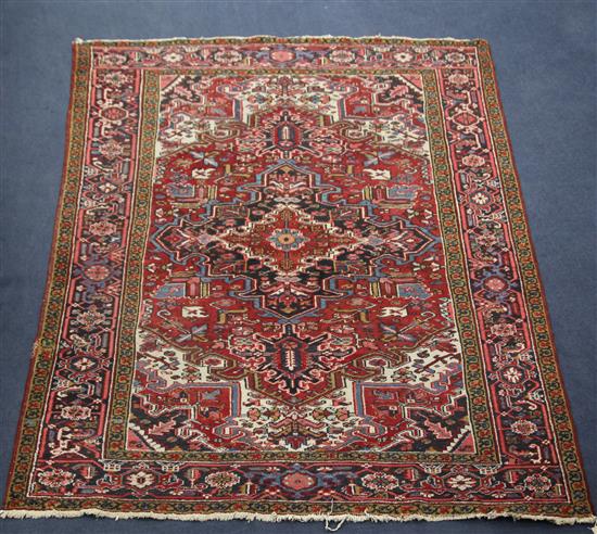 A Heriz rug, 9ft 10in by 7ft 3in.